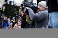 BELLEFONTE, PA - OCTOBER 09: Members of the media shoot video and stills as former Penn State assistant football coach Jerry Sandusky (not pictured) walks into the Centre County Courthouse before being sentenced in his child sex abuse case on October 9, 2012 in Bellefonte, Pennsylvania. Sandusky faces more than 350 years in prison for his conviction in June on 45 counts of child sexual abuse, including while he was the defensive coordinator for the Penn State college football team. (Photo by Patrick Smith/Getty Images)