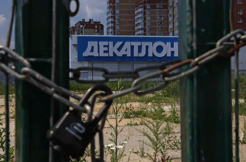 The logo of the Decathlon sporting goods retailer is seen on a closed store in Mytishchi