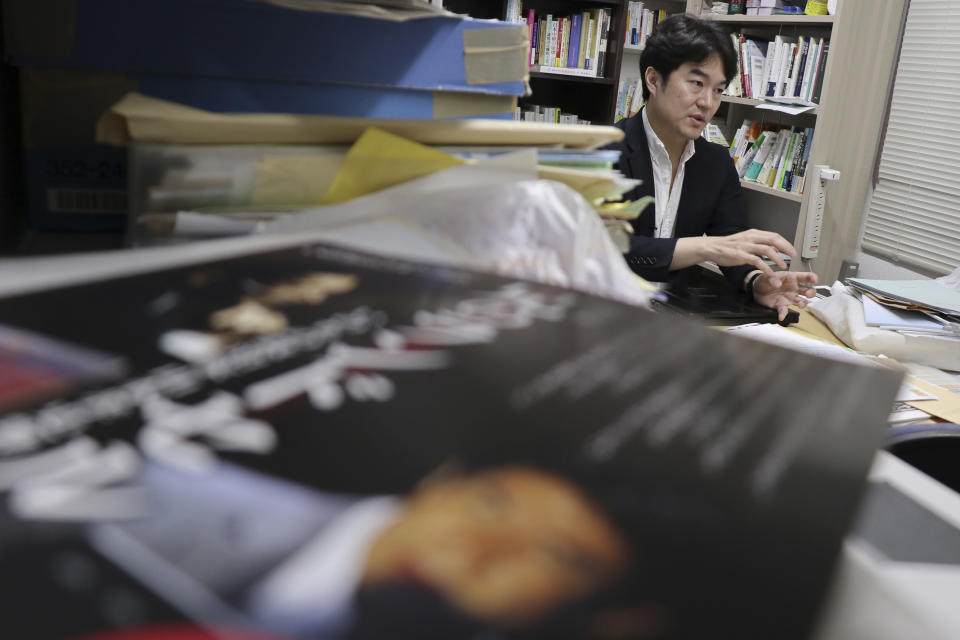 In this March 2, 2017, photo, Yasuyuki Shimizu, founder of Lifelink, a nonprofit that lobbies for suicide-prevention measures, speaks during an interview at his office in Tokyo. Fewer Japanese are taking their own lives, a glimmer of hope in a country with one of the world’s highest suicide rates. “Now we can talk about suicides,” said Shimuzu. “I believe the change in environment has made it easier for the needy to seek help.” (AP Photo/Shizuo Kambayashi)