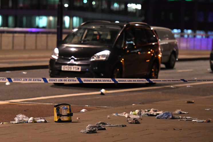 Debris and abandoned cars remain on London at the scene of an apparent terror attack in central London (Chris J Ratcliffe/AFP/Getty Images)