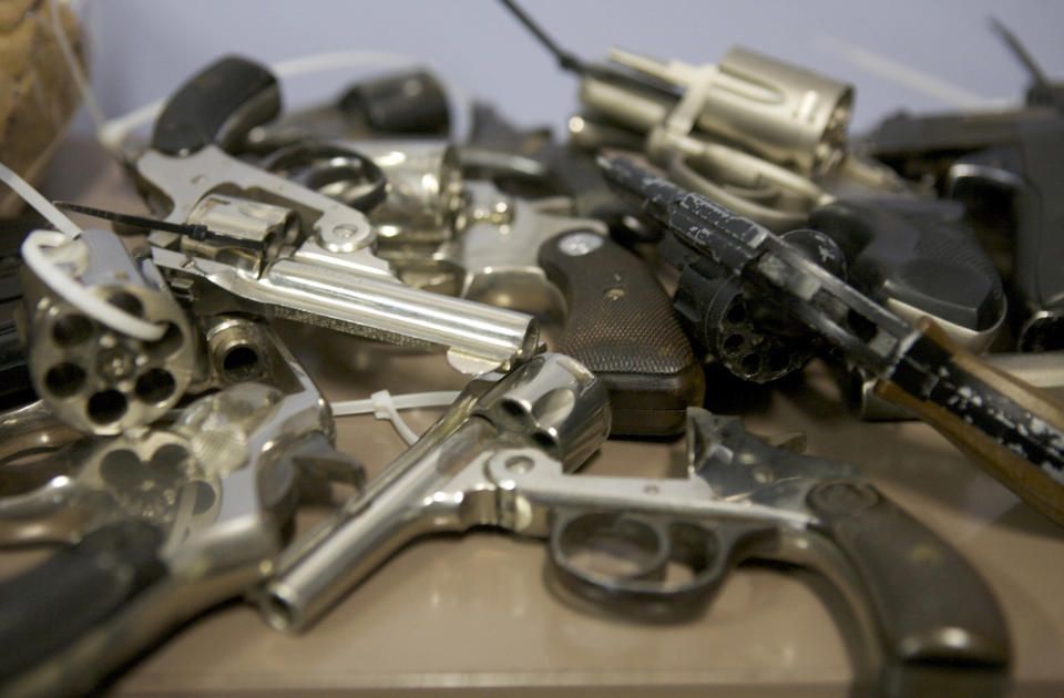 Assorted hand guns turned in during a gun buyback event at the Bridgeport Police Department's Community Services Division in Bridgeport