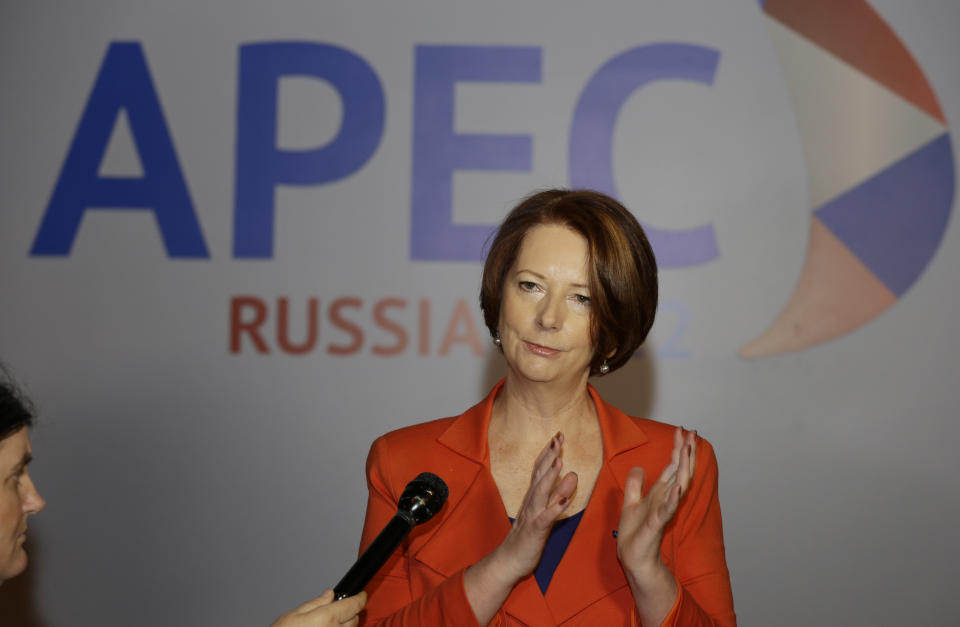 Australian Prime Minister Julia Gillard gestures as she talks to reporters soon after her arrival at the APEC summit in Vladivostok, Russia, Friday, Sept. 7, 2012. (AP Photo/Mark Baker)