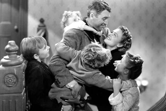 <p>Everett</p> Larry Simms, Jimmy Hawkins, James "Jimmy" Stewart, Donna Reed and Karolyn Grimes in <em>It's a Wonderful Life</em> (1946)