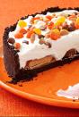 <p>If you'd rather not decorate your cake with gravestones and ghosts, this no-bake peanut butter cheesecake still feels very Halloweeny without any of the fuss. </p><p><strong><em><a href="https://www.womansday.com/food-recipes/food-drinks/recipes/a12933/no-bake-peanut-butter-cheesecake-recipe-wdy1014/" rel="nofollow noopener" target="_blank" data-ylk="slk:Get the No-Bake Peanut Butter Cheesecake recipe.;elm:context_link;itc:0;sec:content-canvas" class="link ">Get the No-Bake Peanut Butter Cheesecake recipe. </a></em></strong></p>