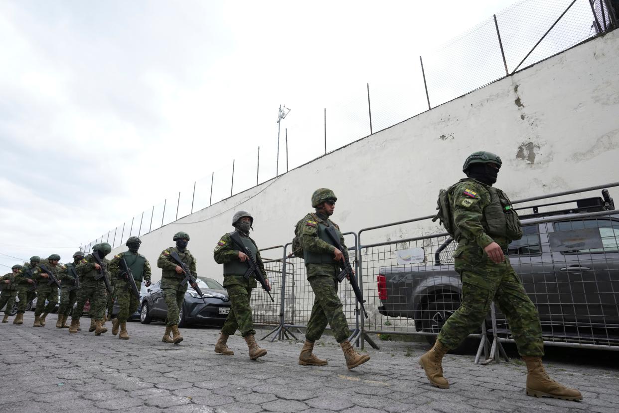 Police and soldiers prepare to enter El Inca prison to quell a riot in Quito, Ecuador, on Jan. 8, 2024. The riot came the day after Ecuadorian authorities reported that, at a different prison in the city of Guayaquil, Los Choneros gang leader Adolfo Macías, alias “Fito,” was not in his cell. A decade ago, he fled from another facility.