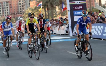 Paz Bash of Israel (R) crosses the finish line during Women Elite Road Race in the UCI Road World Championships 2016, in Doha, Qatar October 15, 2016. REUTERS/Stringer/Files