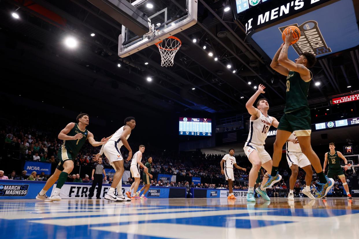 Colorado State Rams guard Nique Clifford (10) shoots the ball over Virginia Cavaliers guard Taine Murray (10) in the second half at UD Arena.