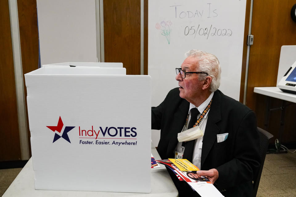 FILE - Raymond Broedel casts his ballot at the City-County Building in the final hours of early voting in the primary election in Indianapolis, Monday, May 2, 2022. The great vote-by-mail wave appears to be receding just as quickly as it arrived. After tens of millions of Americans opted for mail ballots during the pandemic election of 2020, voters in the early primary states are returning in droves to in-person voting. (AP Photo/Michael Conroy, File)