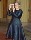 <p>Adele opted for an embroidered navy A-line dress and a statement headpiece for her visit to receive an OBE from the Queen. And just like that, we're not bored by blue dresses anymore.</p>