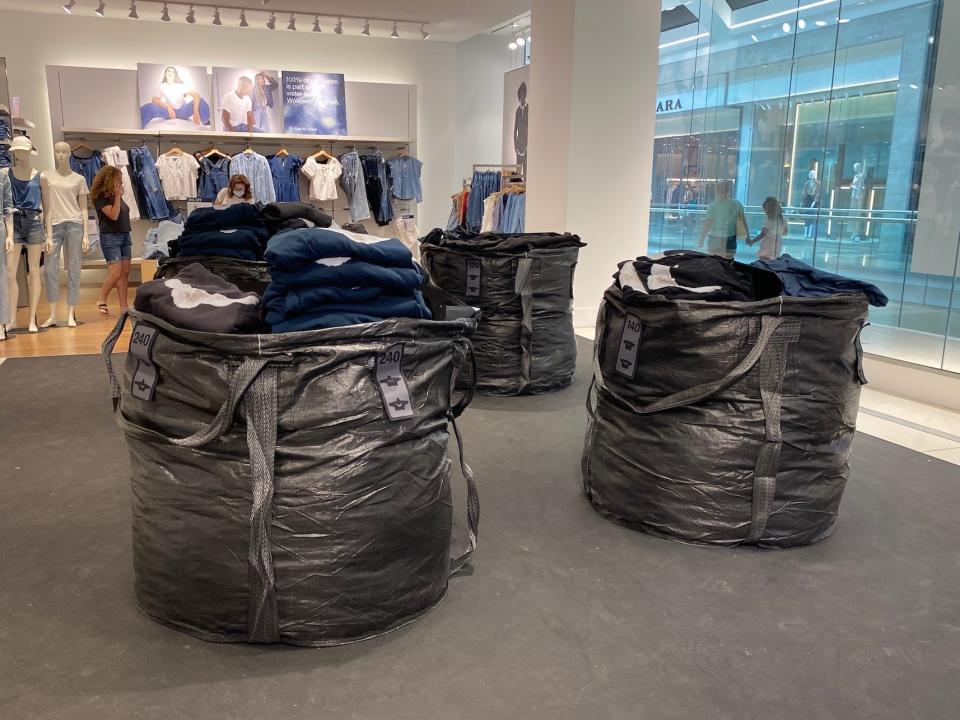 Trash bags filled with Yeezy clothes at a New Jersey Gap store on August 17, 2022.