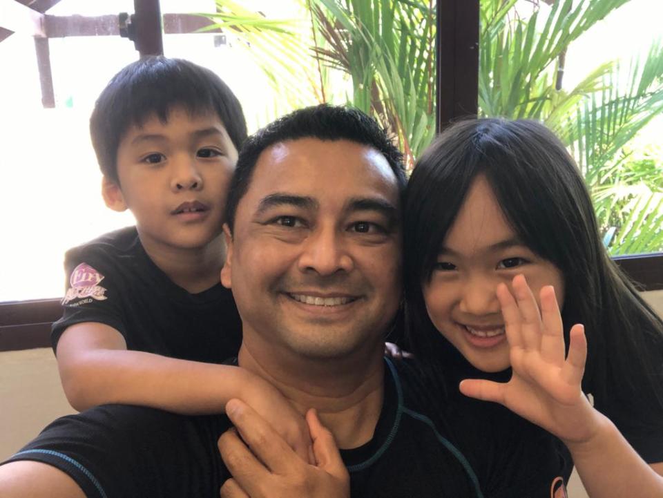 Faisal Bushfield, 54, is currently quarantined at Aloha Changi Resort with his children - five-year-old Arden (left) and Ariane, 6, amid the Wuhan virus outbreak. They were evacuated from Wuhan on 30 January, but his wife Haiyan, 41, was unable to leave as she is a Chinese national. PHOTO: Faisal Bushfield