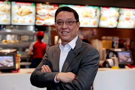 Ernesto Tanmantiong, President and CEO of Philippine national champion Jollibee Foods Corp., poses inside a Jollibee branch in Pasig City