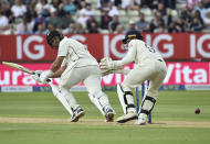 New Zealand's Ross Taylor, left, plays a shot during the second day of the second cricket test match between England and New Zealand at Edgbaston in Birmingham, England, Friday, June 11, 2021. (AP Photo/Rui Vieira)