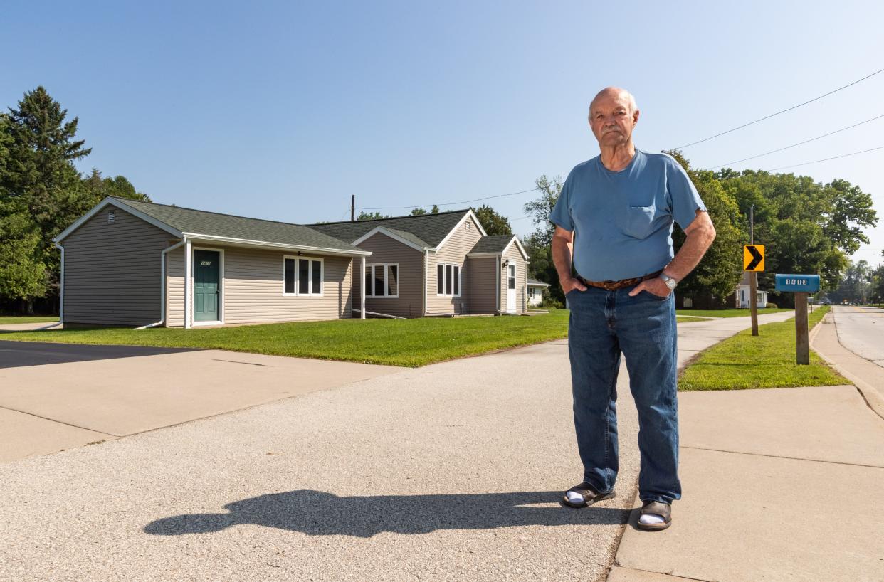 Cornelius Vannieuwenhoven stands in front of his house in Suamico, Wis., on Friday, Aug. 18, 2023. The house has been hit by vehicles three times in the last seven years.