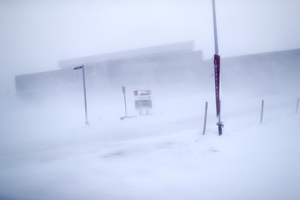 In this Feb. 21, 2019, photo, the entrance to Norton Sound Regional Hospital is seen through a snow storm in Nome, Alaska. The hospital serves Nome and surrounding villages of the Bering Strait region. (AP Photo/Wong Maye-E)