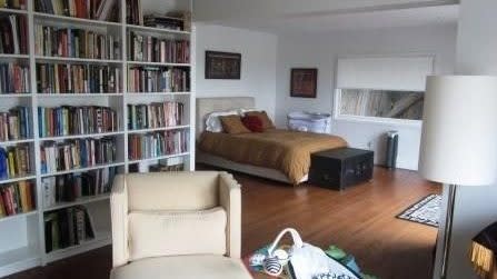 Master suite with library style sitting area.