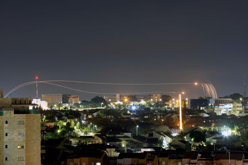 Iron Dome anti-missile system fires interception missiles as rockets are launched from Gaza towards Israel, as seen from the city of Ashkelon