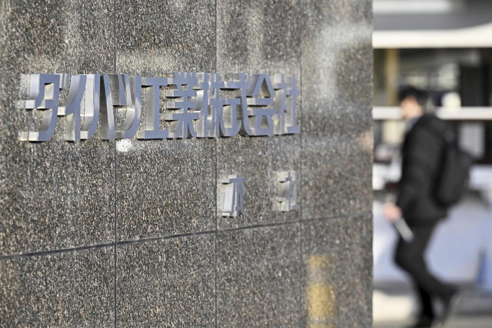 The signage of Daihatsu Motor Co. is seen at its headquarters in Ikeda, Osaka prefecture, western Japan Tuesday, Dec. 26, 2023. Toyota Motor Corp. subsidiary Daihatsu has shut down production lines at all its four factories Tuesday as transport ministry officials investigate the company’s improper tests for safety certification. (Kyodo News via AP)