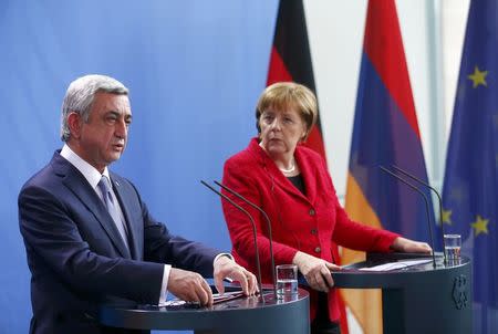 Armenia's President Serzh Sargsyan and German Chancellor Angela Merkel address a news conference after talks at the Chancellery in Berlin, Germany, April 6, 2016. REUTERS/Hannibal Hanschke