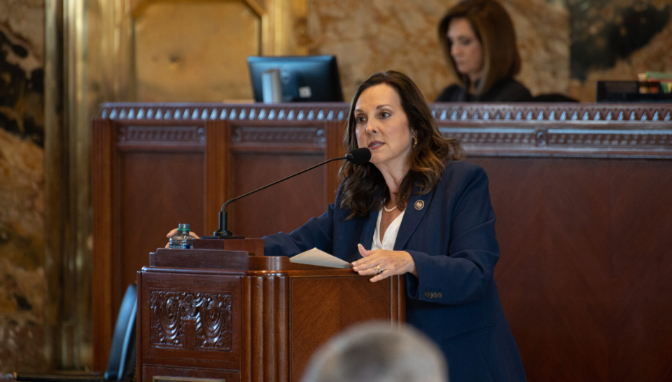 Rep. Debbie Villio, R-Kenner, stands at the podium in the House Chamber to speak on her bill.