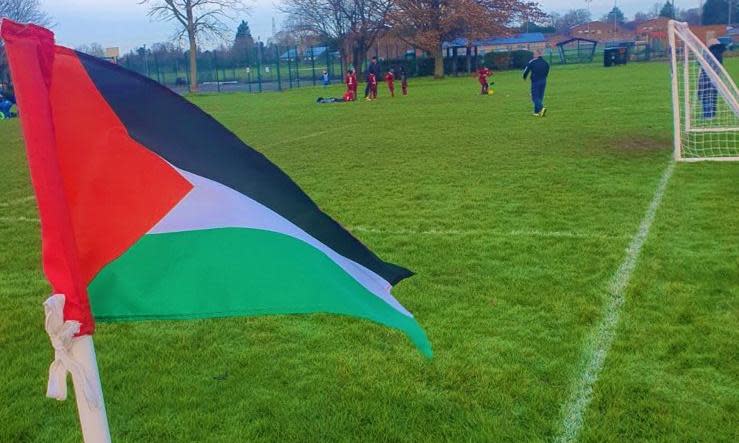 <span>One of the Palestine corner flags used by Queens Park Crescents on Sunday.</span><span>Photograph: QPCFC</span>