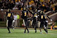 Missouri defensive back Daylan Carnell (13) celebrates with teammates after recovering a fumble during the first half of an NCAA college football game against Georgia Saturday, Oct. 1, 2022, in Columbia, Mo. (AP Photo/L.G. Patterson)