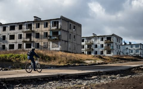 Unfinished flat blocks on the Kuril island of Iturup - Credit: Sergei Krasnoukhov/TASS via Getty