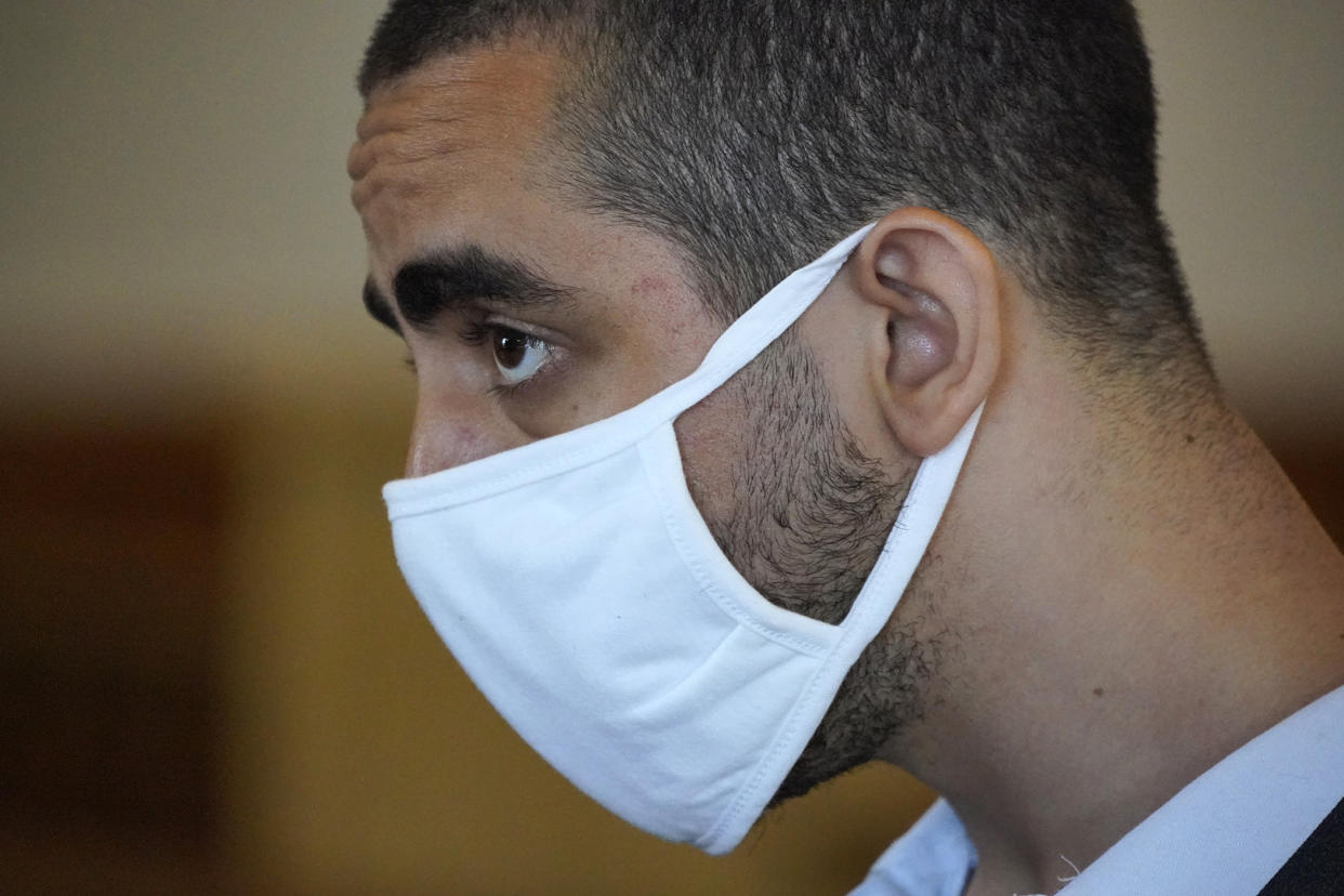Hadi Matar, 24, listens while being arraigned in the Chautauqua County Courthouse in Mayville, N.Y., Saturday, Aug. 13, 2022. Matar who is accused of carrying out a stabbing attack against “Satanic Verses” author Salman Rushdie has entered a not-guilty plea on charges of attempted murder and assault. An attorney for Matar entered the plea on his behalf during the arraignment hearing. (AP Photo/Gene J. Puskar)