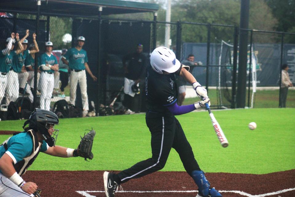 Trinity Christian batter Brayden Harris (9) connects with a pitch as Providence catcher Landon Jones awaits the ball on Monday.