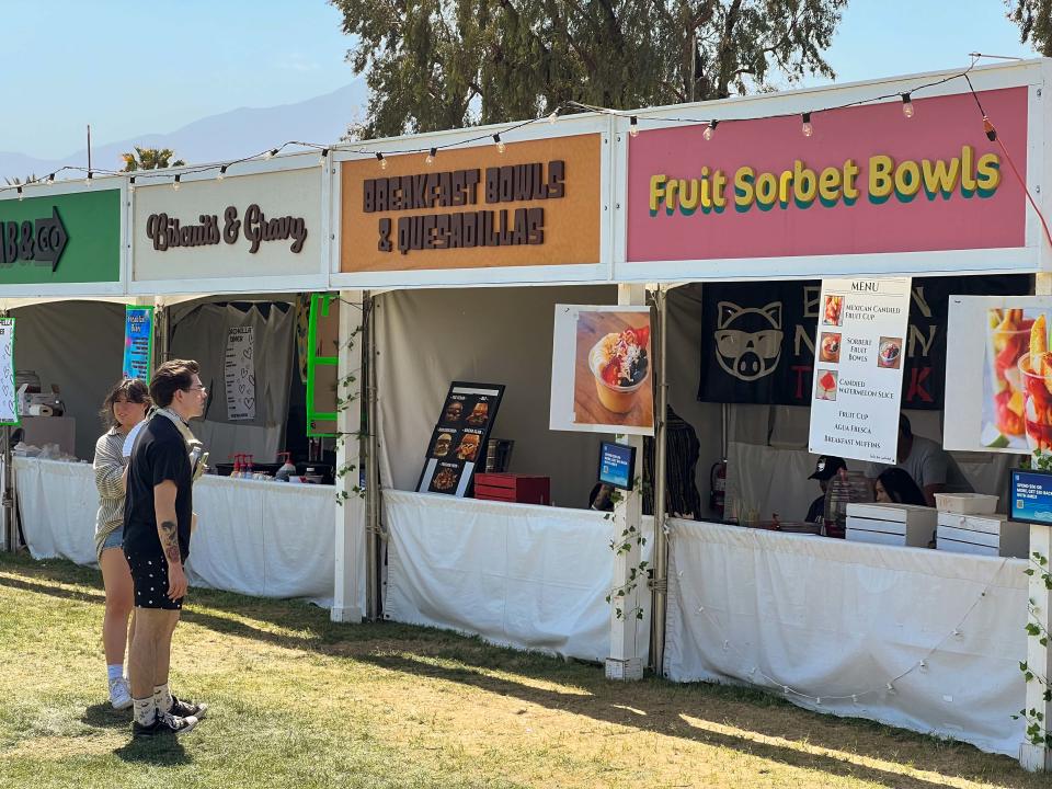 Food options — from açai bowls to chicken and waffles to quesadillas — abound in the camping hub of the Coachella Valley Arts and Music Festival in Indio, Calif., on April 14, 2023. Most entrees run in the $14 to $20 price range.