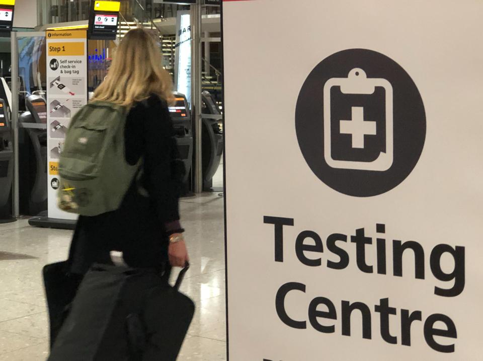 Testing times: a traveller at Heathrow  Terminal 2 (Simon Calder)