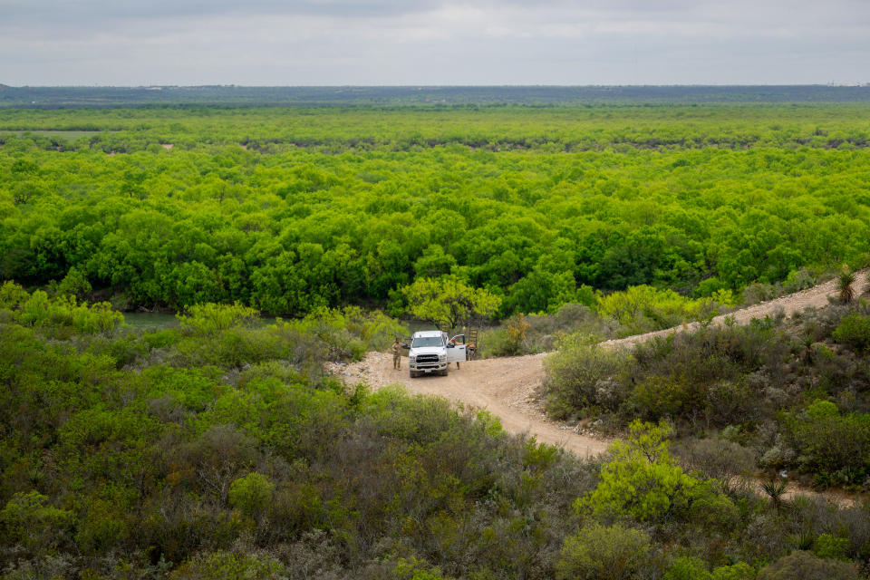 National Guard soldiers patrol a dirt road in 2024 in Eagle Pass.