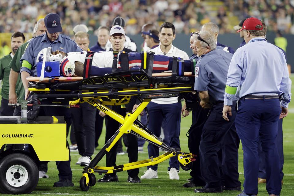 New England Patriots cornerback Isaiah Bolden is brought off the field after being injured during the second half of a preseason NFL football game against the Green Bay Packers, Saturday, Aug. 19, 2023, in Green Bay, Wis. The game was suspended after the injury. (AP Photo/Matt Ludtke)