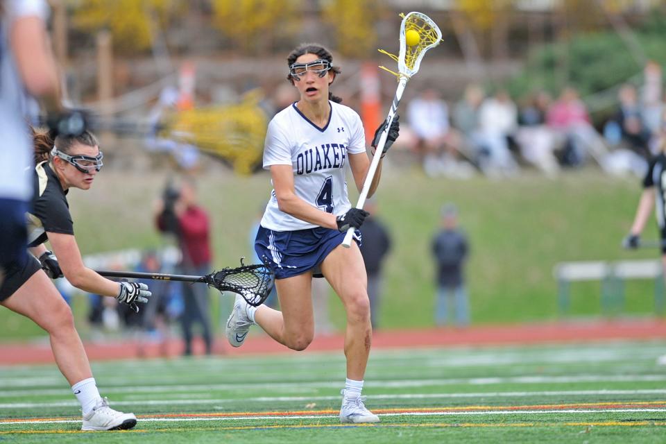 Moses Brown's Sophia Gorriaran looks for some space in the defense during a lacrosse game in April against North Kingstown.