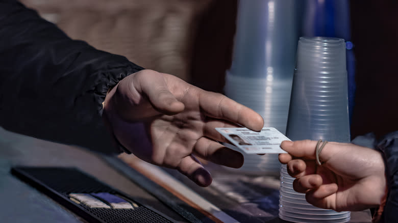 Man showing ID for drink 