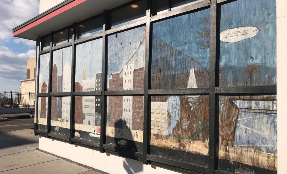 A mural that's been on the side of Isaac's menswear store downtown since it lost a window to Hurricane Fran in 1996. The New York City-inspired street scene was painted by the children of owner Isaac Lazar.