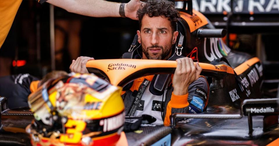Daniel Ricciardo climbs in his car, serious face. Austin October 2022 Credit: Alamy