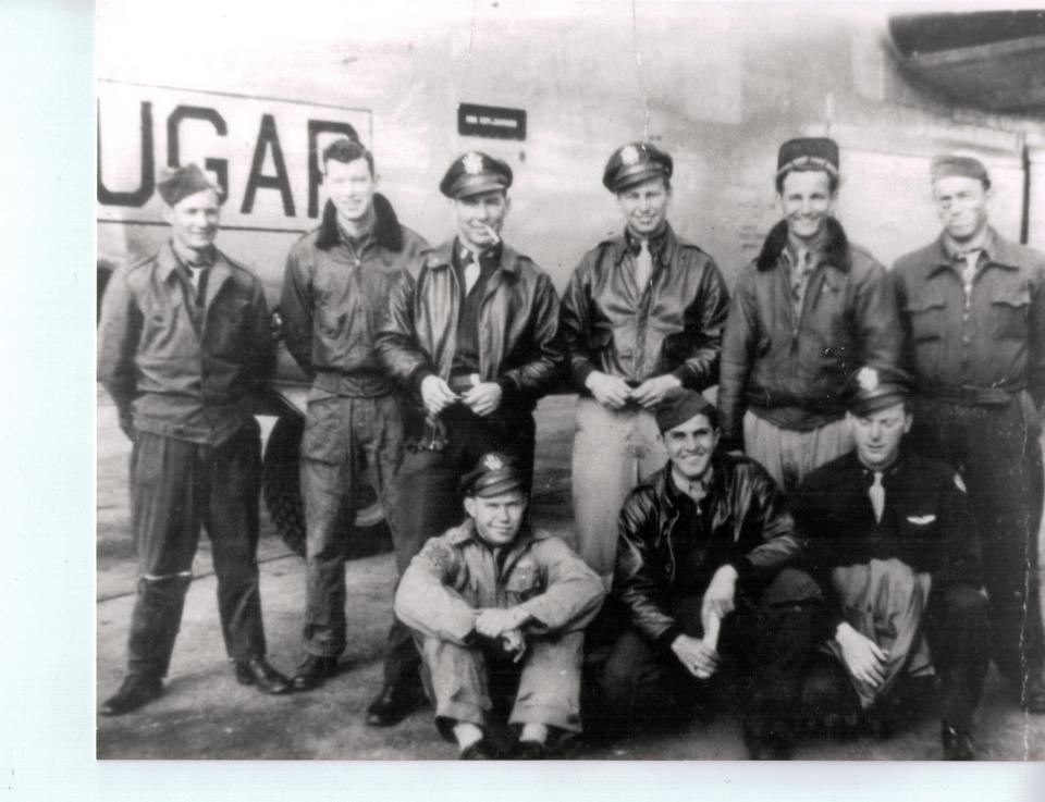 Si Liberman, squatting in the center of the front row, with his B-24 bomber crew in World War II, as seen in a Stars and Stripes front page photo.