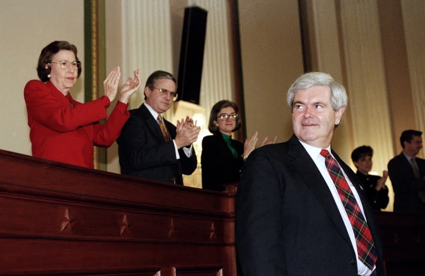 Future House Speaker Newt Gingrich of Georgia looks over his shoulder as he arrives for a Capitol Hill news conference, Monday, Dec. 5, 1994 in Washington, after his fellow Republicans voted him as speaker. To serve alongside Gingrich, the Republicans voted Rep. Dick Armey, R-Texas, as House Majority Leader and Rep. Tom DeLay, R-Texas, as House Majority Whip. (AP Photo/John Duricka)