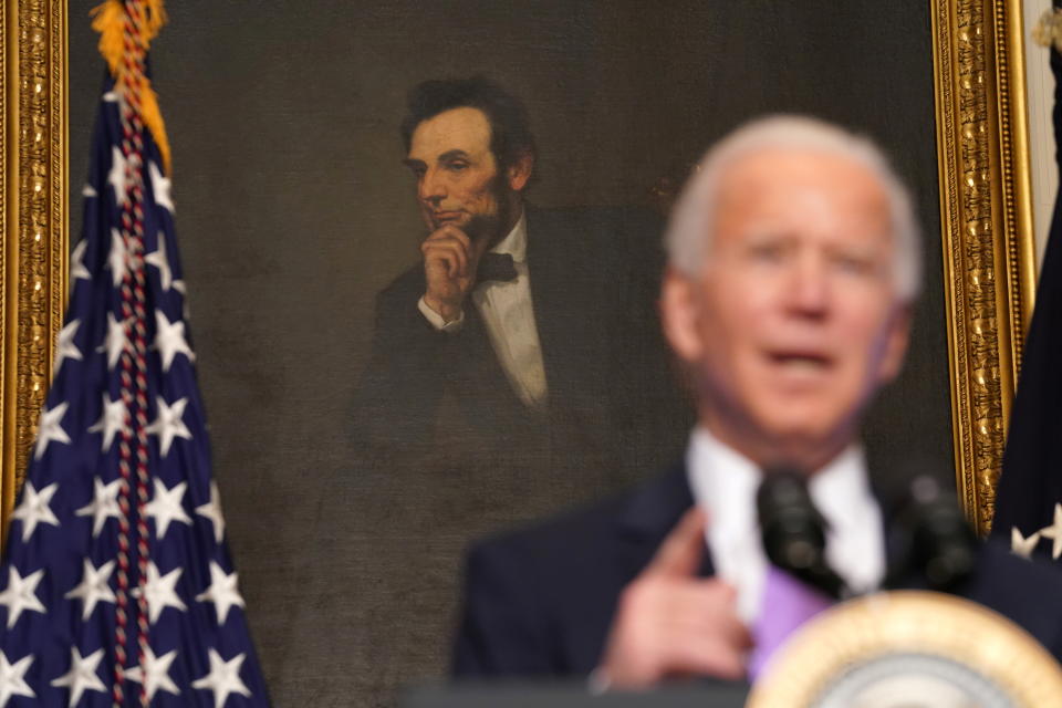 U.S. President Joe Biden speaks about the fight to contain the coronavirus disease (COVID-19) pandemic, in front of a portrait of Abraham Lincoln at the White House in Washington, U.S. January 26, 2021. REUTERS/Kevin Lamarque