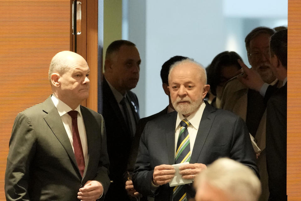 Luiz Inacio Lula da Silva, President of Brazil, right, and German Chancellor Olaf Scholz arrive for a German and Brazil governments meeting at the chancellery in Berlin, Germany, Monday, Dec. 4, 2023. (AP Photo/Markus Schreiber)