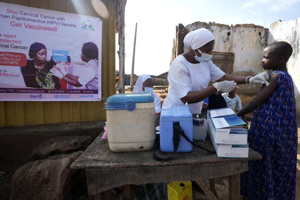 A health worker administers a cervical cancer vaccine HPV Gardasil to a girl on the street in Ibadan, Nigeria, on May 27, 2024. African countries have some of the world's highest rates of cervical cancer. Growing efforts to vaccinate more young girls for the human papillomavirus are challenged by the kind of vaccine hesitancy seen for some other diseases. Misinformation can include mistaken rumors that girls won't be able to have children in the future. Some religious communities must be told that the vaccine is "not ungodly." More than half of Africa's 54 nations – 28 – have introduced the vaccine in their immunization programs, but only five have reached the 90% coverage that the continent hopes to achieve by 2030. (AP Photo/Sunday Alamba)