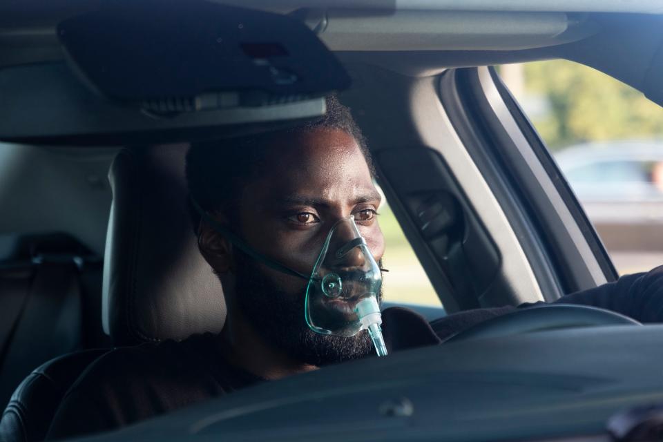 "Tenet," starring John David Washington, is still holding on to a July release date as the rest of the summer movie season has become a wasteland in the wake of coronavirus.