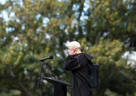 An imam leads a Friday prayer at Hagley Park outside Al-Noor mosque in Christchurch, New Zealand March 22, 2019. REUTERS/Edgar Su