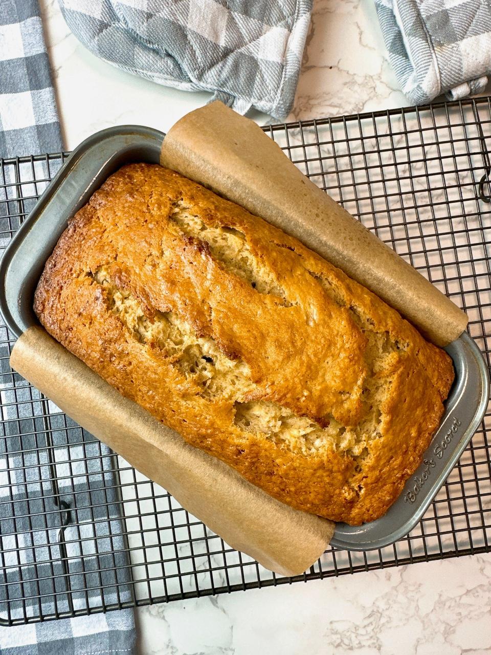 Don’t overbake your banana bread. Start checking after 50 minutes of baking. When finished, a wooden pick inserted near the center of the bread will come out with little moist bits clinging to it.