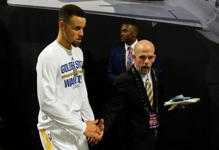 June 19, 2016; Oakland, CA, USA; Golden State Warriors guard Stephen Curry (30) leaves the press conference with vice president of communications Raymond Ridder following the 93-89 loss against the Cleveland Cavaliers iin game seven of the NBA Finals at Oracle Arena. Mandatory Credit: Cary Edmondson-USA TODAY Sports