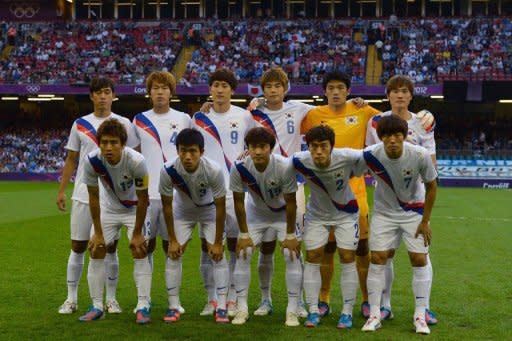 South Korea's national football team pose for a photo prior to their bronze medal match at the London 2012 Olympic Games, on August 10, at the Millenium stadium in Cardiff. S.Korea won 2-0