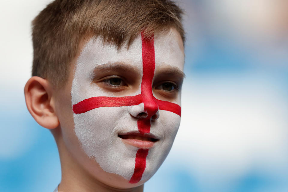 <p>An England fan inside the stadium before the match </p>