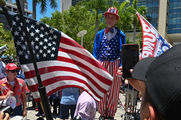 Onlookers gather outside the courthouse on June 13.