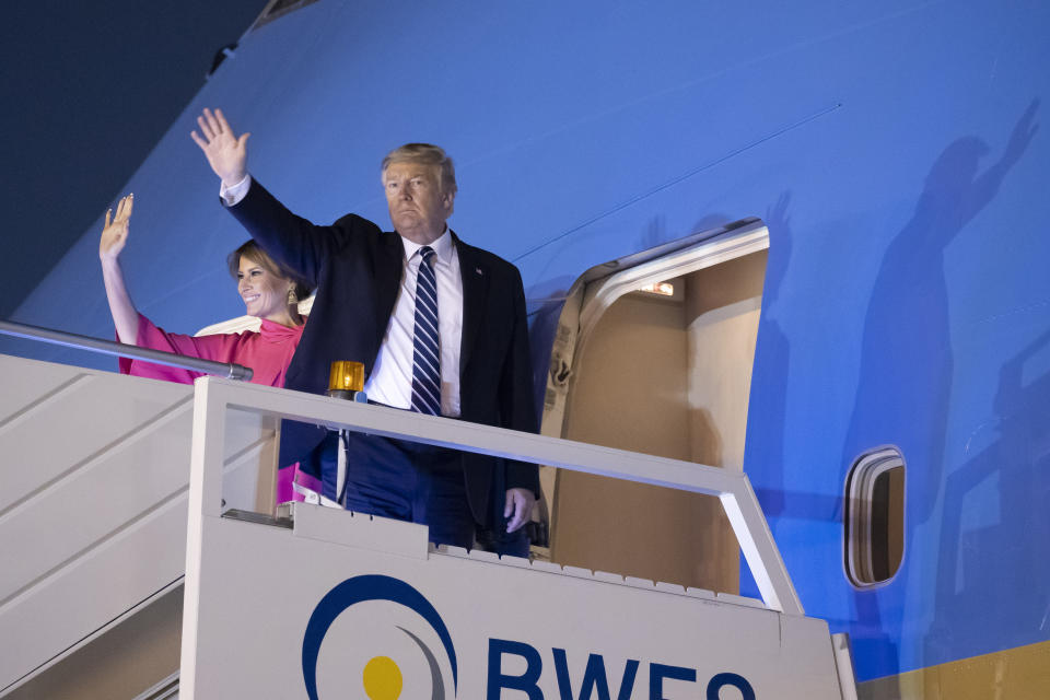 U.S.President Donald Trump, and first lady Melania Trump, wave as board Air Force One upon departure from at Indian Air Force Palam airport, Tuesday, Feb. 25, 2020, in New Delhi, India. (AP Photo/Alex Brandon)